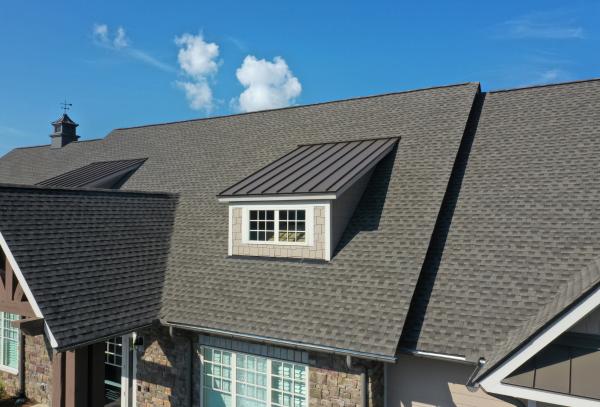 Finished architectural shingle roof on an upscale home in the Greater Houston area, installed by Garrick Roofing