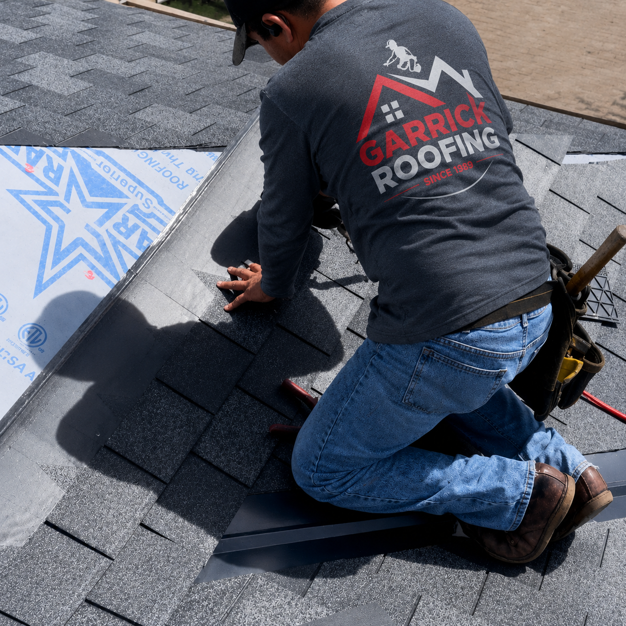 Garrick Roofing installer laying shingles over Superior synthetic underlayment on a Houston-area roof